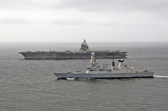 USS Enterprise sails alongside Type 45 destroyer HMS Diamond as the two vessels exercised together in the Middle East / 8 August 2012