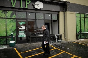 A customer walks away from VIP Cannabis at 2949 W. Alameda Ave. in Denver on Nov. 21, 2013. Federal officials raided the shop Thursday. (Hyoung Chang, The Denver Post)