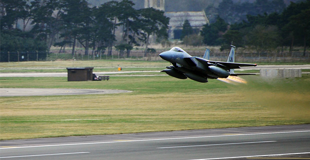 A F-15C Eagle takes off from a base in England.
